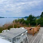Beachfront With Sun Terraces On Helgoy Feriehus *